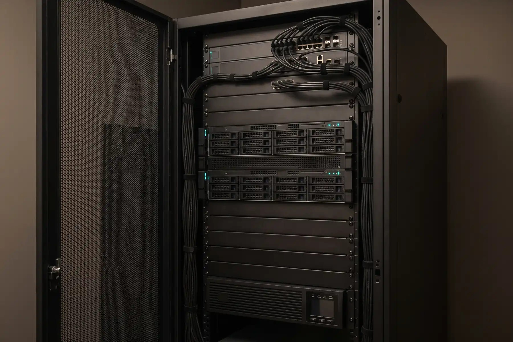 A single rack in a controlled customer space—dedicated compute, blanking panels, UPS, and dressed cabling. Placement, power, and physical custody stay with the customer’s IT organization.